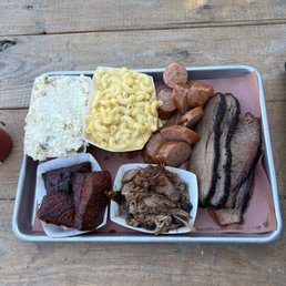 Smoked Prime Brisket, 1/4 lb. Link Sausage, Creamy Mac & Cheese, Cajun Potato Salad, Pulled Pork and burnt ends!