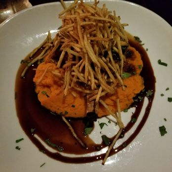 Foxhole Culinary Tavern - Pork chop with sweet potatoes - New American Near Me - Austin, Texas Foxhole Culinary Tavern - Pork chop with sweet potatoes - New American Near Me - Austin, Texas