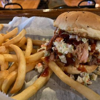 Greystone Tavern - a pulled pork sandwich and french fries - American Near Me - Jackson, Michigan