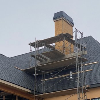 Certified Fireplace and Chimney - We setup our own scaffolding to get to where we need to. Custom chimney cap in this case. - Chimney Sweeps Near Me - Topeka, Kansas Certified Fireplace and Chimney - We setup our own scaffolding to get to where we need to. Custom chimney cap in this case. - Chimney Sweeps Near Me - Topeka, Kansas