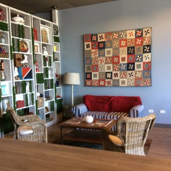 Shelby's - a living room with a quilt on the wall - Cafes Near Me - Waukegan, Illinois Shelby's - a living room with a quilt on the wall - Cafes Near Me - Waukegan, Illinois