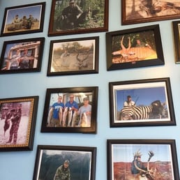 This is a wall in Peter's that showcases the owner and his dozens of African big game hunts, is he the next Dentist you decide This is a wall in Peter's that showcases the owner and his dozens of African big game hunts, is he the next Dentist you decide