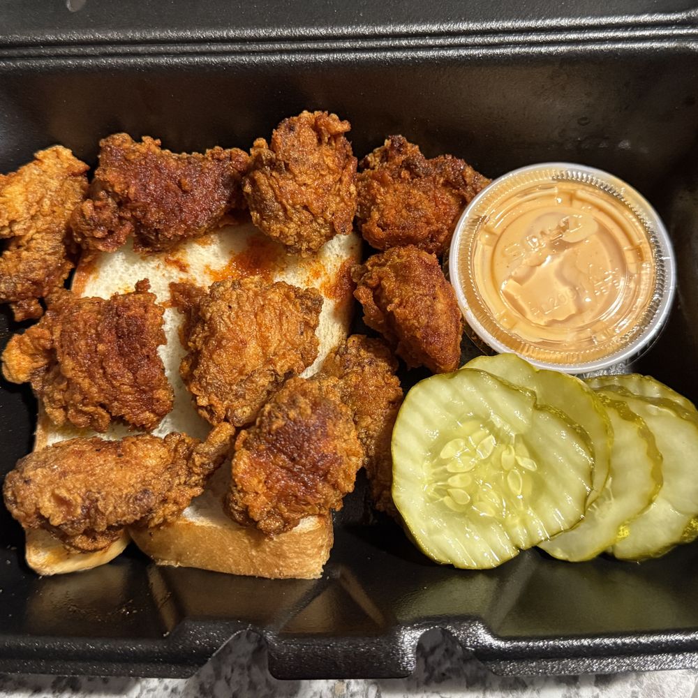 Dave's Hot Chicken - 10 Piece Dave's Bites on a piece of bread , Dave's Sauce , Pickle Slices - Chicken Shop Near Me - Yukon, Oklahoma Dave's Hot Chicken - 10 Piece Dave's Bites on a piece of bread , Dave's Sauce , Pickle Slices - Chicken Shop Near Me - Yukon, Oklahoma