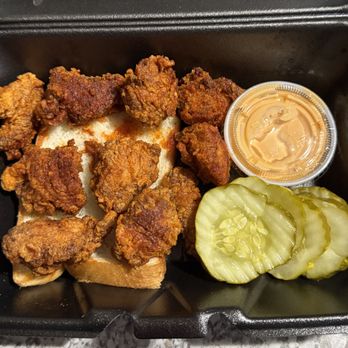 Dave's Hot Chicken - 10 Piece Dave's Bites on a piece of bread , Dave's Sauce , Pickle Slices - Chicken Shop Near Me - Yukon, Oklahoma Dave's Hot Chicken - 10 Piece Dave's Bites on a piece of bread , Dave's Sauce , Pickle Slices - Chicken Shop Near Me - Yukon, Oklahoma