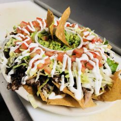 Gorditas Don Coco - NACHOS- Comes with your choice of meat, melted cheese, a side of guacamole, lettuce, tomato and sour cream. Can serve up to 3 people.