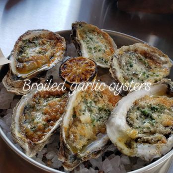 District Seafood - Broiled garlic herb oysters - Seafood Near Me - Savannah, Georgia District Seafood - Broiled garlic herb oysters - Seafood Near Me - Savannah, Georgia