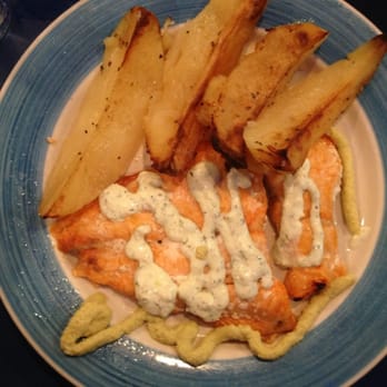 Pithari Taverna - Salmon with Artichoke and tzatziki sauce with yummy Lemon potatoes. - Greek Near Me - Highland Park, New Jersey Pithari Taverna - Salmon with Artichoke and tzatziki sauce with yummy Lemon potatoes. - Greek Near Me - Highland Park, New Jersey