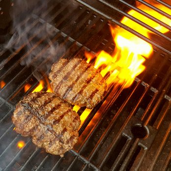 Walnut Hollow Ranch - two steaks cooking on a grill - Meat Shops Near Me - Hayesville, North Carolina Walnut Hollow Ranch - two steaks cooking on a grill - Meat Shops Near Me - Hayesville, North Carolina