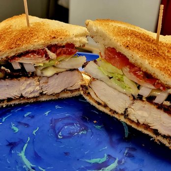 Hickory House - a cut in half sandwich on a blue plate - Bars Near Me - Huntsville, Alabama Hickory House - a cut in half sandwich on a blue plate - Bars Near Me - Huntsville, Alabama