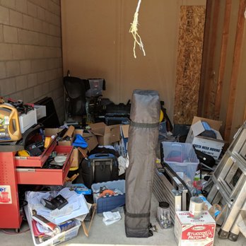Public Storage - boarded-up whole the thief used to access my unit. everything was in boxes neatly stacked until they tossed my unit searching for valuables. - Self Storage Near Me - Huntington Beach, California