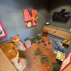 Lynnwood Kids Dentist - Waiting room including Classic Nintendo, behind water and coffee; hand washing stations.