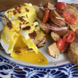 Egg Benedict w/ side of potatoes Egg Benedict w/ side of potatoes