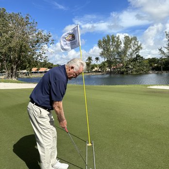 Richard Metz Golf Instruction - Richard Metz putting with aiming sticks for alignment. - Golf Lessons Near Me - Doral, Florida Richard Metz Golf Instruction - Richard Metz putting with aiming sticks for alignment. - Golf Lessons Near Me - Doral, Florida