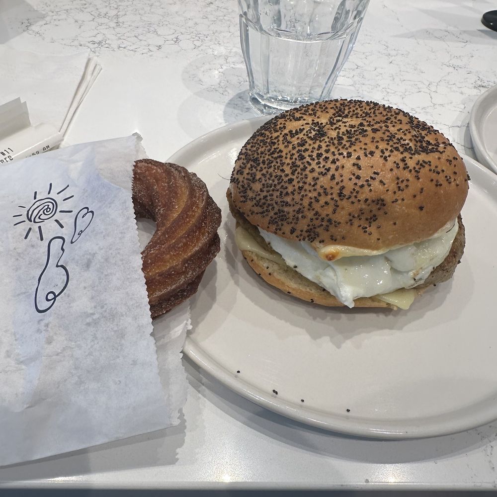 Daily Provisions - Cinnamon sugar cruller and Chicken sausage egg and cheese sandwich - Wine Bars Near Me - Washington, DC, District of Columbia