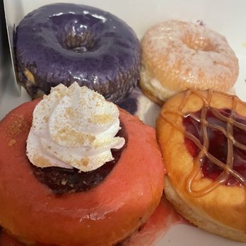 Painted Dough - Top and bottom left to right: Deteriorated ube donut, churro donut, strawberry donut, and PBJ - Donuts Near Me - Chino, California