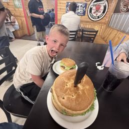 My boy has never seen a burger this big. He is use to the size on his own plate. My boy has never seen a burger this big. He is use to the size on his own plate.