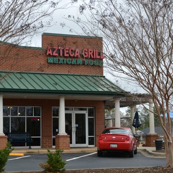 Azteca Grill - a red car parked in front of a mexican restaurant - Mexican Near Me - Clover, South Carolina