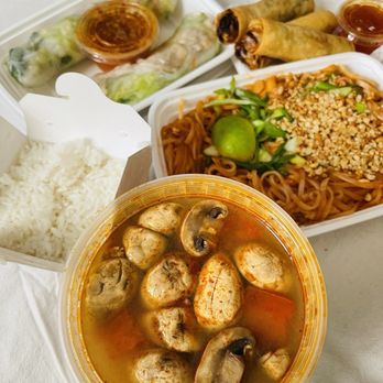 Khao Hom Thai - Thom Yum Po-Tak (front) Pad Thai (right) Spring Rolls (back left), Egg Rolls (back right) - Thai Near Me - Minneapolis, Minnesota Khao Hom Thai - Thom Yum Po-Tak (front) Pad Thai (right) Spring Rolls (back left), Egg Rolls (back right) - Thai Near Me - Minneapolis, Minnesota