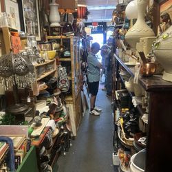 White Elephant Resale Store - Thin aisles full of lots of junk.