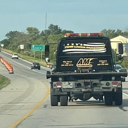 AM towing's truck with a tasteless "tow lives matter" flag in the rear window