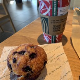 a blueberry muffin and a cup of coffee