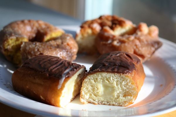 Photo of Dom Bakeries - Ypsilanti, MI, US. Inside of custard donut - custard consistency is more of the liquidy side, doesn't have a lot of flavor