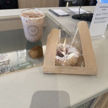 Lvl Up Coffee - Iced Masala Chai and a raspberry croissant pastry - Coffee & Tea Near Me - Chicago, Illinois