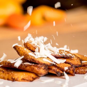 Arepasmania - a pile of fried bananas on a plate - Venezuelan Near Me - Sunrise, Florida Arepasmania - a pile of fried bananas on a plate - Venezuelan Near Me - Sunrise, Florida
