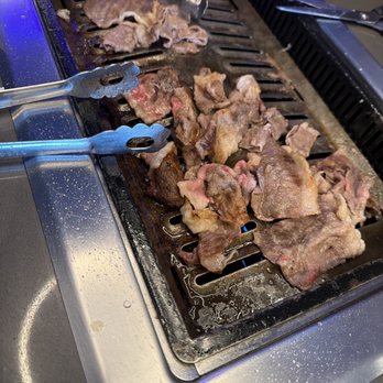 Mr. Kim's Korean BBQ - Beef belly cooking on the grill - Korean Near Me - Las Vegas, Nevada Mr. Kim's Korean BBQ - Beef belly cooking on the grill - Korean Near Me - Las Vegas, Nevada