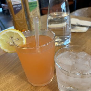 Nando's Peri-Peri - Water and watermelon mint lemonade - Chicken Shop Near Me - Addison, Texas Nando's Peri-Peri - Water and watermelon mint lemonade - Chicken Shop Near Me - Addison, Texas