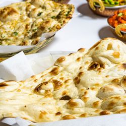 Own Masala Indian Restaurant, Bar and Takeaways  - Freshly baked naan bread come from Tandoori oven