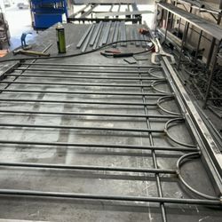 Innovative Metal Works - 70s style ornamental iron fence during fabrication process.