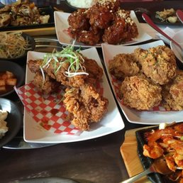 Pork belly, red Spicy fried chicken, original fried chicken, jap chae, Spicy chicken, soysauce garlic fried chicken, and side dishes. Pork belly, red Spicy fried chicken, original fried chicken, jap chae, Spicy chicken, soysauce garlic fried chicken, and side dishes.