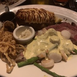 The Keg Steakhouse + Bar - Medium rare Prime Rib* w/ Twice Baked Potato* & Shrimp & Scallop Oscar*