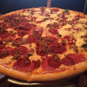 Rocco's - Half lasagna pizza, half three pig pizza. 20 inches of goodness but some of these slices are HUGE! - Bars Near Me - Seattle, Washington