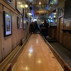 The Barking Spider - Shuffle board table at the Barking Spider