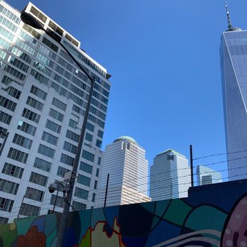 Club Quarters Hotel World Trade Center, New York - Hotel is on the left with the freedom tower on the right. - Hotels Near Me - New York, New York Club Quarters Hotel World Trade Center, New York - Hotel is on the left with the freedom tower on the right. - Hotels Near Me - New York, New York