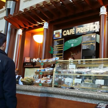 Cafe Presto - a man standing in front of a counter - Coffee & Tea Near Me - Boston, Massachusetts Cafe Presto - a man standing in front of a counter - Coffee & Tea Near Me - Boston, Massachusetts