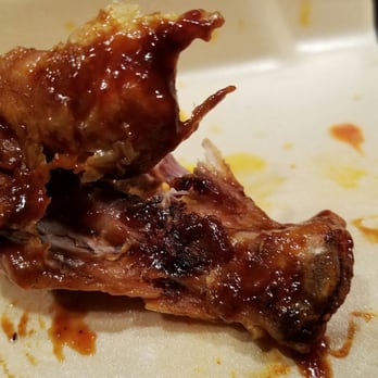 Wingstop - This one the meat was so dark and the bone so burnt I couldn't even take a bite. Disgusting! - Chicken Wings Near Me - Cedar Park, Texas