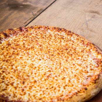 Pizza X - a cheese pizza on a wooden table - Pizza Near Me - Bloomington, Indiana Pizza X - a cheese pizza on a wooden table - Pizza Near Me - Bloomington, Indiana
