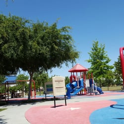 Freedom Park - Notice the MISSING Swings on the right that should be hanging and the black POTHOLES on the ground