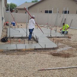 A pad for a future hot tub and a sidewalk from the back of the house around to the pad A pad for a future hot tub and a sidewalk from the back of the house around to the pad