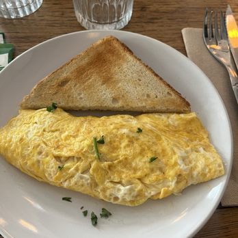Café Madame - Amazingly cooked ham and cheese omelette. The picture does it no justice, the magic is on the inside. - Breakfast & Brunch Near Me - Paris, 75