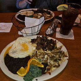 Chilaquiles El Paso with the New Mexico green chili, beef tips, and eggs over easy. Chilaquiles El Paso with the New Mexico green chili, beef tips, and eggs over easy.