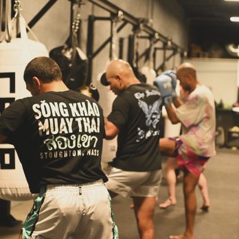 Song Khao - SK Muay Thai bag work - our gym features ten heavy bags to help sharpen technique and get the blood flowing. - Muay Thai Near Me - Stoughton, Massachusetts Song Khao - SK Muay Thai bag work - our gym features ten heavy bags to help sharpen technique and get the blood flowing. - Muay Thai Near Me - Stoughton, Massachusetts