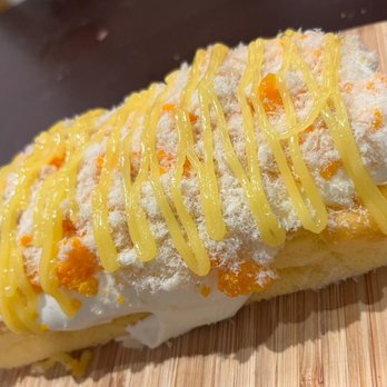 Tina Cake Desserts - Salted duck egg on top of a soft sponge cake. Was actually one of my favorite as the cake was so fluffy - Vietnamese Near Me - Vancouver, British Columbia Tina Cake Desserts - Salted duck egg on top of a soft sponge cake. Was actually one of my favorite as the cake was so fluffy - Vietnamese Near Me - Vancouver, British Columbia