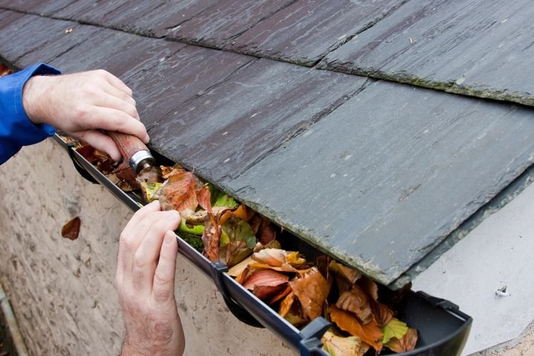 Slide of Gutter Clutter Cleaning & Roof Repair