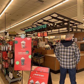 Starbucks - a man standing in a coffee shop - Coffee & Tea Near Me - Ridgecrest, California
