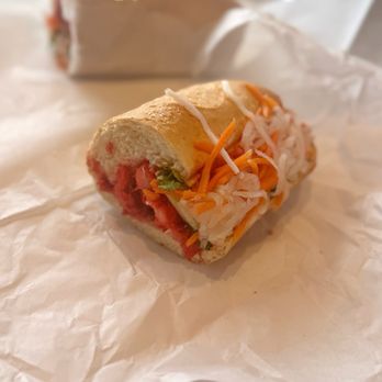 Ca Phe - bbq pork bahn mi - you can't really see it here, but it is very, very hot pink. Like sweet-and-sour sauce. - Coffee & Tea Near Me - Northglenn, Colorado