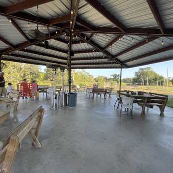 The 159 Junction - Outdoor area with giant connect 4, corn hole to right and volleyball around the corner - Sports Bars Near Me - Fayetteville, Texas The 159 Junction - Outdoor area with giant connect 4, corn hole to right and volleyball around the corner - Sports Bars Near Me - Fayetteville, Texas